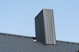 House roof and chimney showing roof flashing installation requirements
