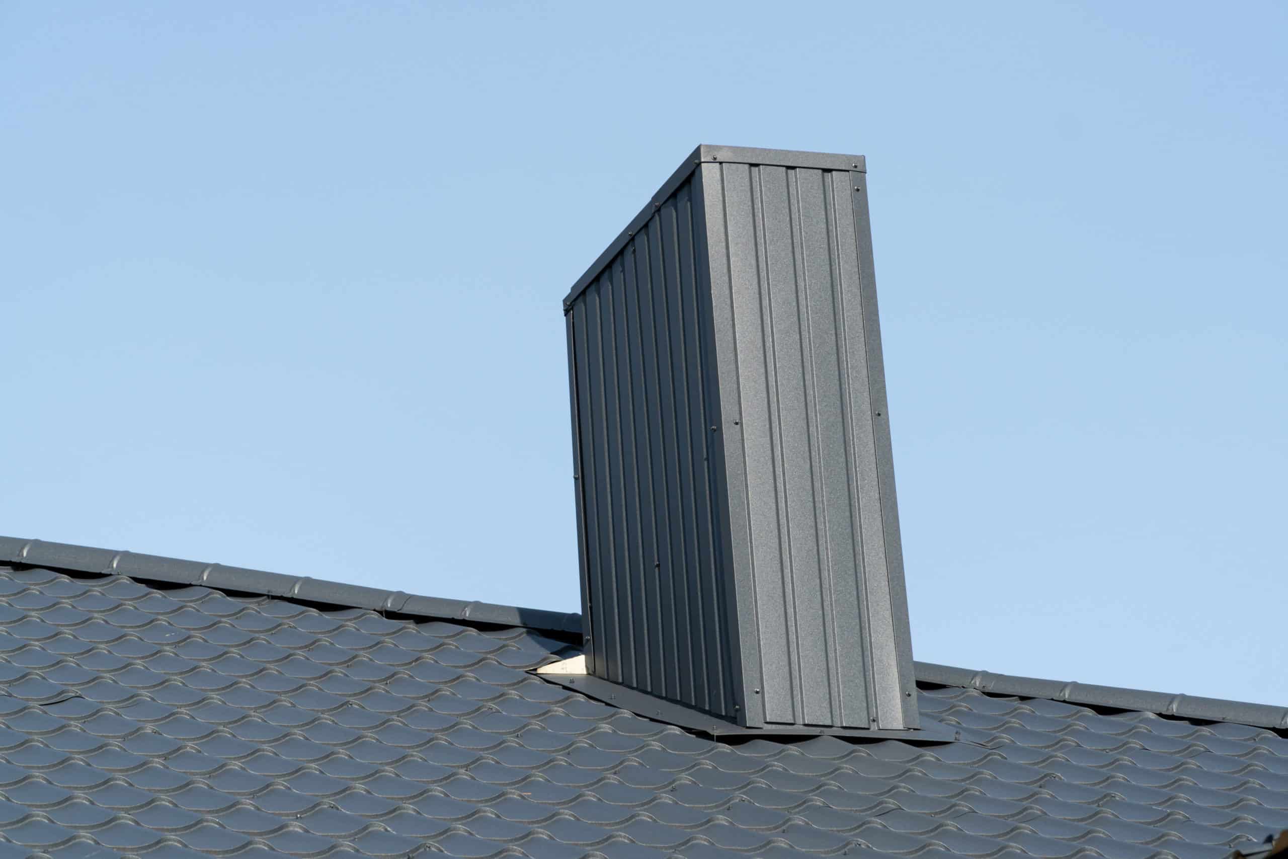 House roof and chimney showing roof flashing installation requirements